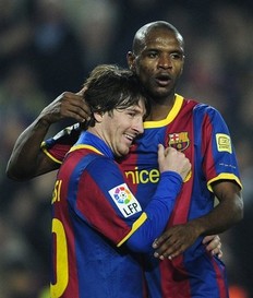 Eric Abidal et Lionel Messi